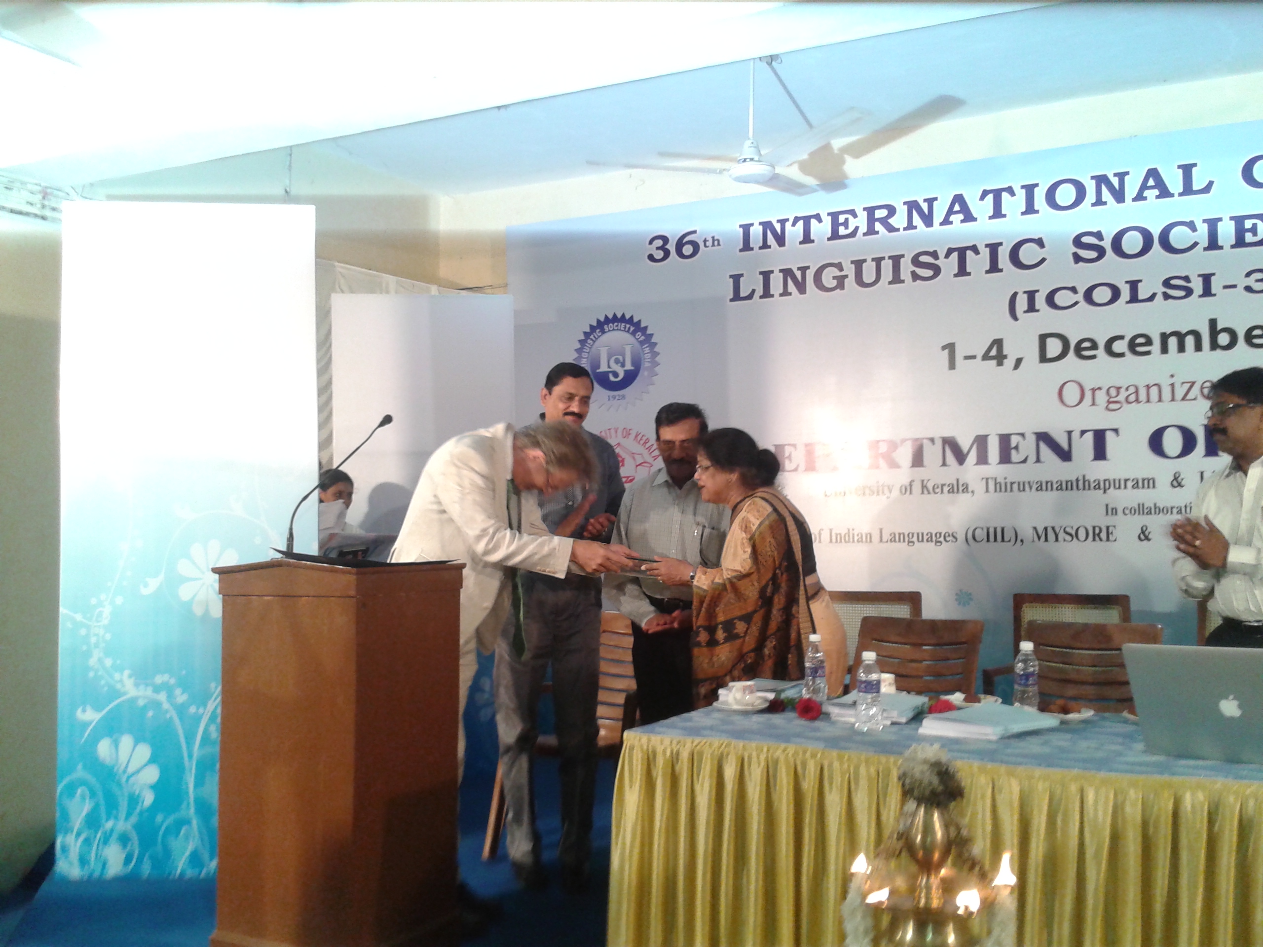 Dr. Abbi receiving award